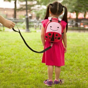 skip hop zoolet-backpack and harness-ladybug-in action